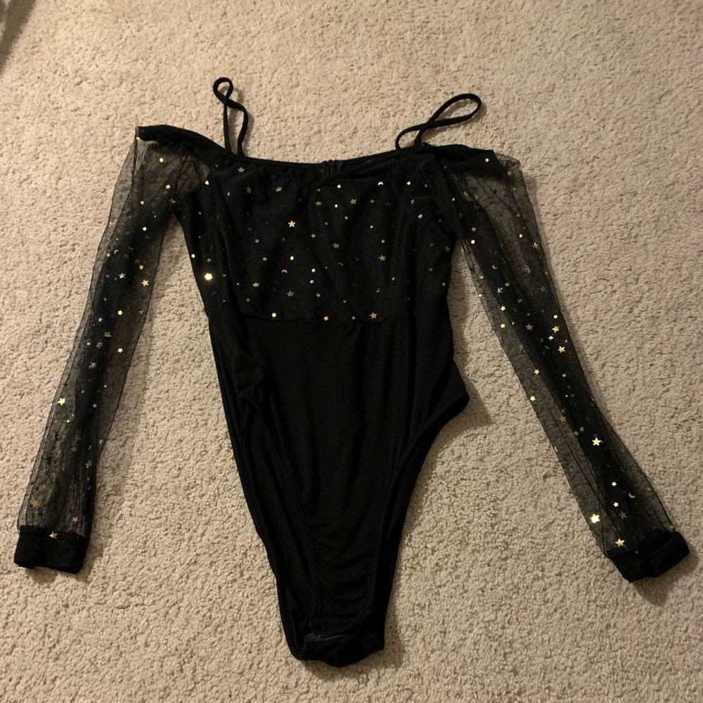 Black and gold star body suit.